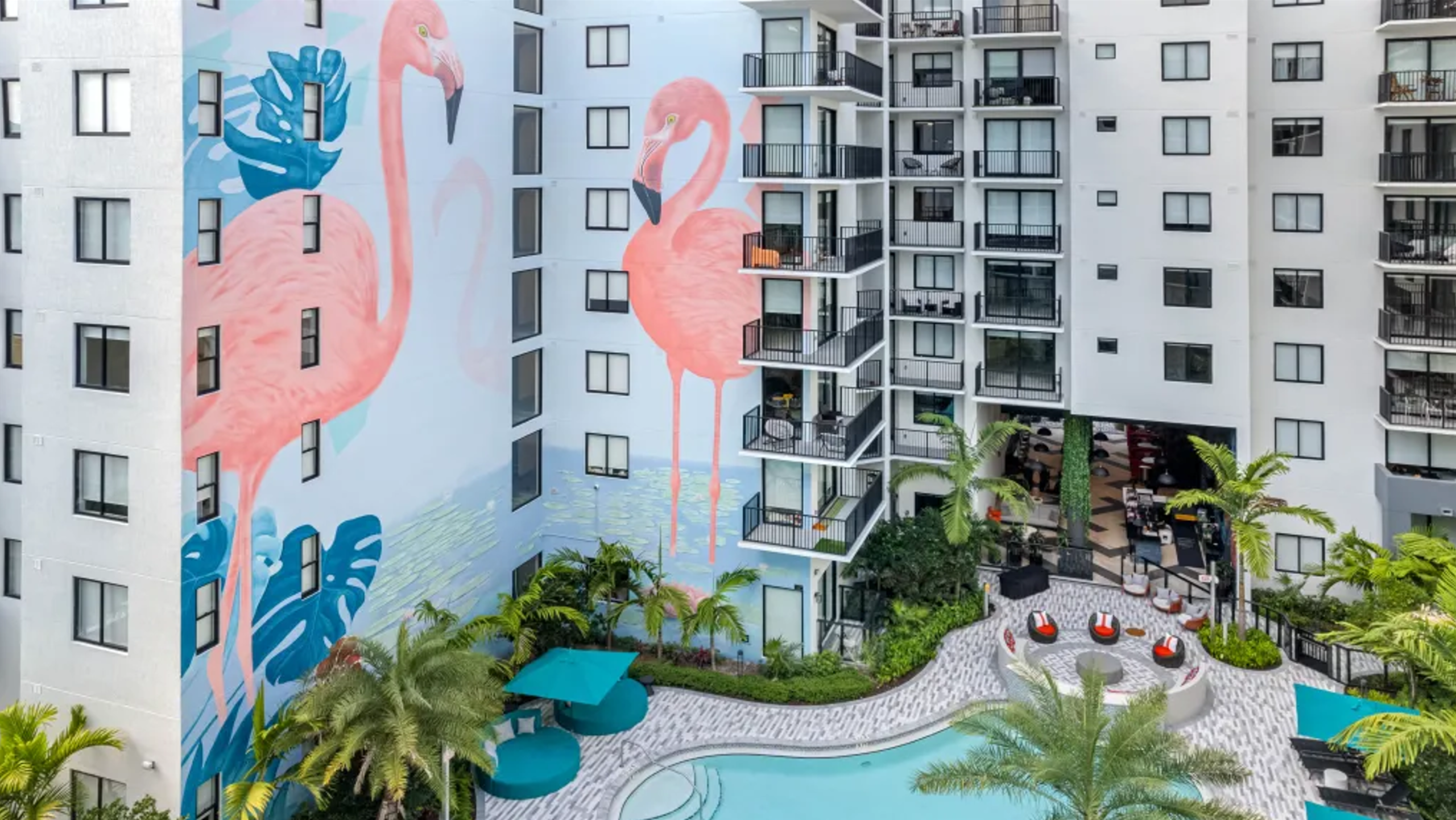 midrise-mural-luxury-apartment-building-facade-courtyard-pool-deck-coilor-dreamers
